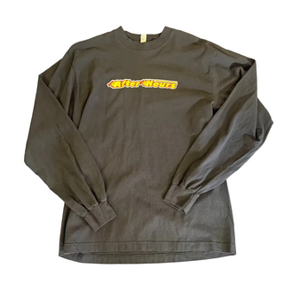 Black long-sleeve shirt with a logo on a gray surface