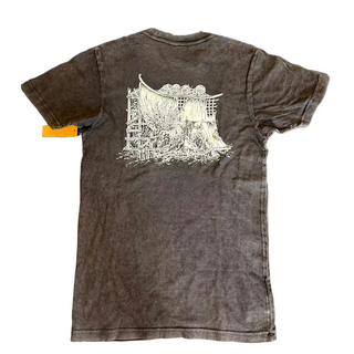 Brown t-shirt with white graphic design on a textured gray surface