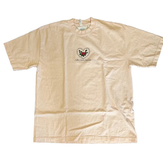 Beige t-shirt with a logo on a dark textured surface