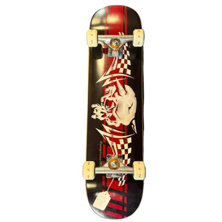A skateboard with a black deck featuring a red and white graphic of a skull wearing a flag and a checkered flag design. The skateboard is shown from a top-down view against a plain white background.
