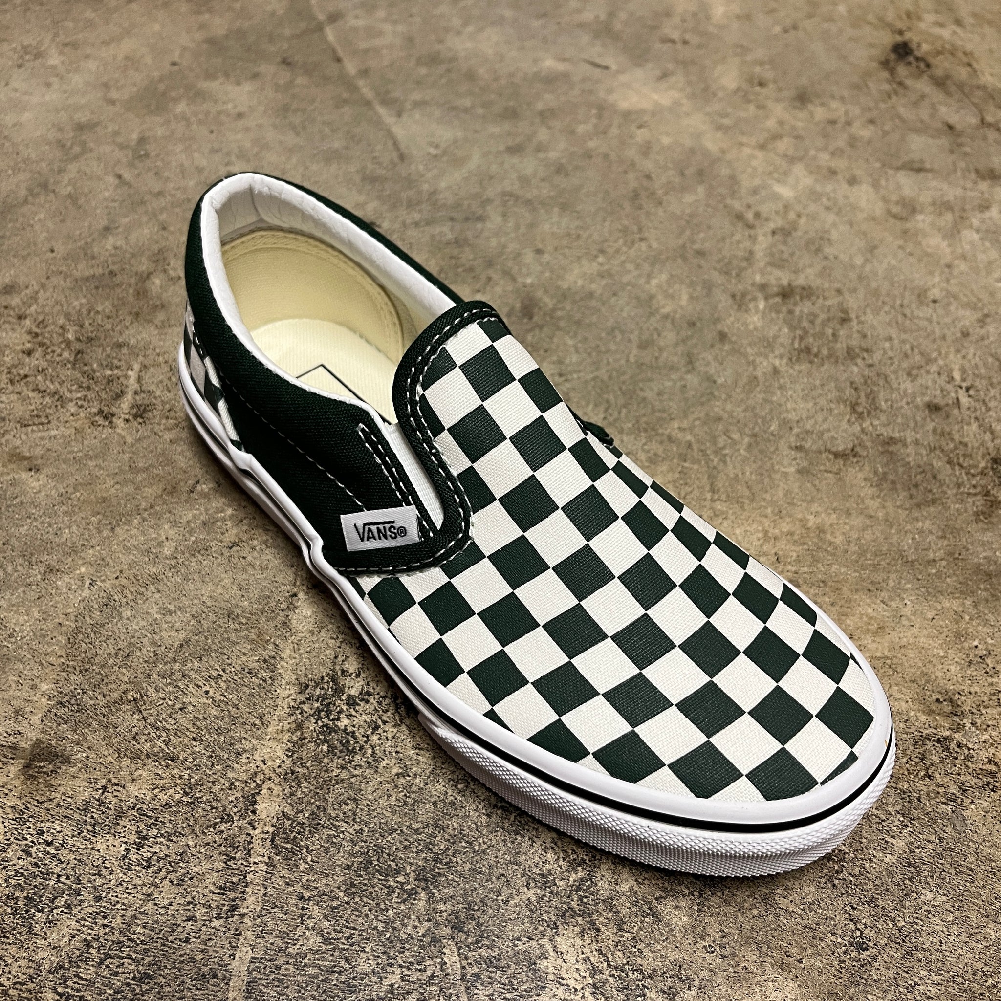 Black and white checker slip shops on vans