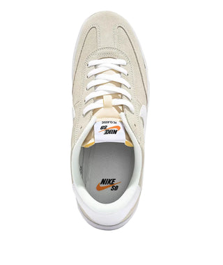 Beige sneaker with white laces on a white background