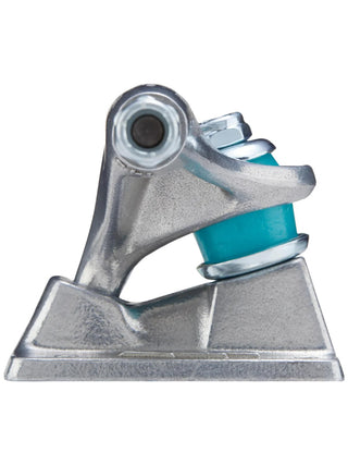 Metal skateboard truck with a blue bushing on a white background