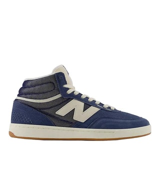 Blue high-top sneaker with white accents on a light gray background