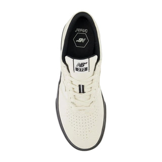 White sneaker with black accents on a white background